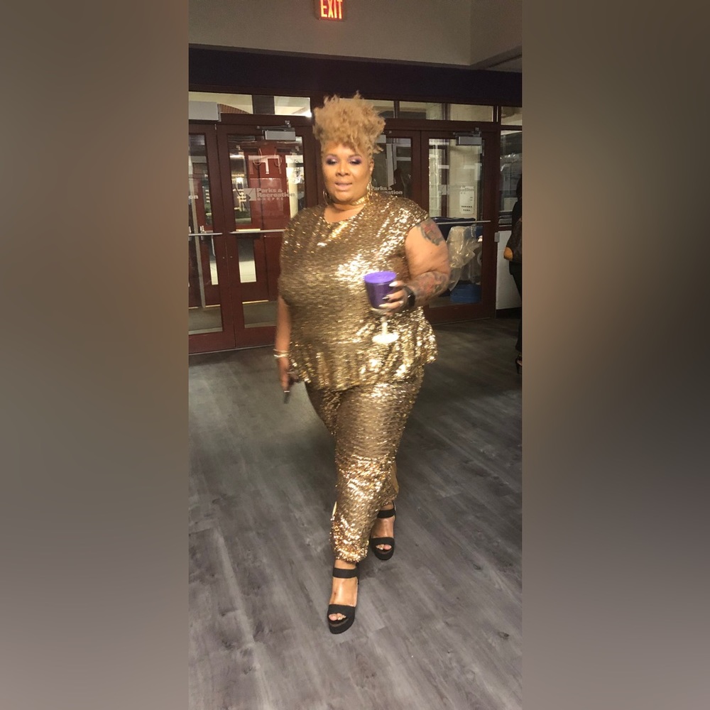 Be Holiday ready in this Monif C Gold Sequin Peplum Jumpsuit 3X